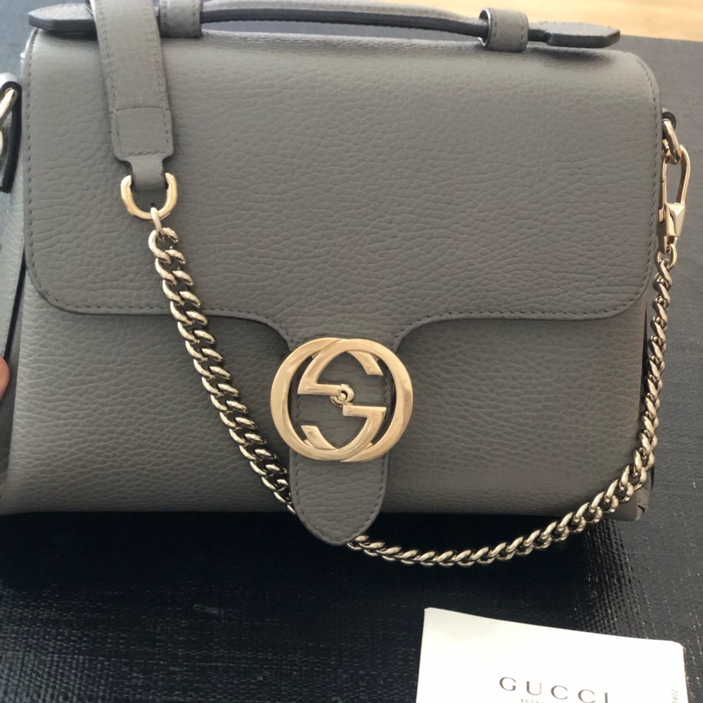 Grey Gucci bag with gold accent. medium bag with dust bag and authenticity card.